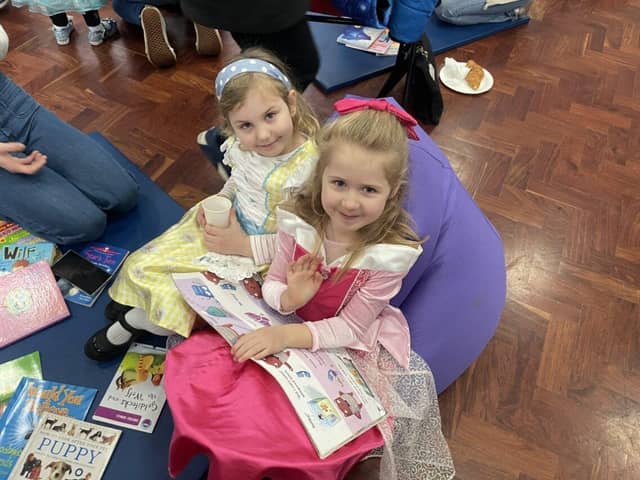 Parents at Queen Eleanor Primary read with their children to mark the start of World Book Day