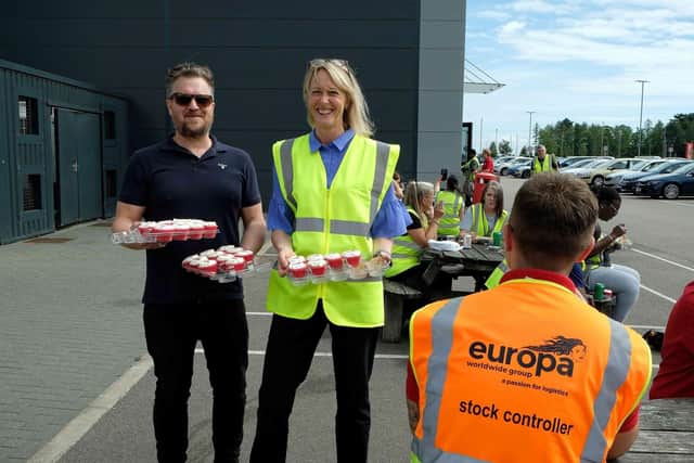 Dionne Redpath handing out anniversary cupcakes in Corby. Photo: Europa Worldwide Group