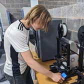 Student Lucas Buksh uses one of the 3D printers at Northampton College