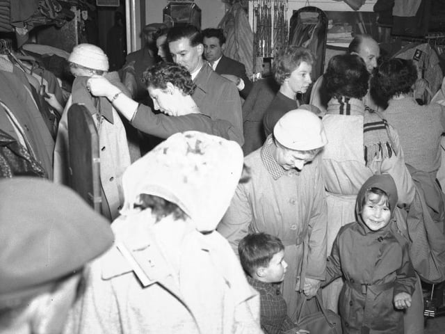 Customers look for bargains in the January sales at The Mac Shop, January 2, 1960