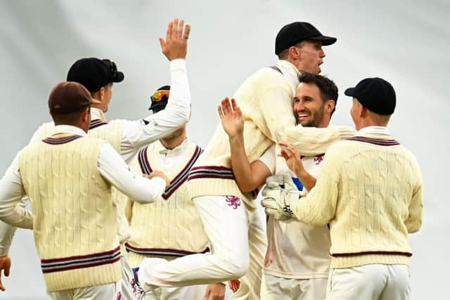 Lewis Gregory and his Somerset team-mates celebrate the dismissal of Saif Zaib (Photo by Harry Trump/Getty Images)