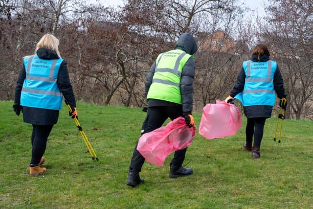 An anti-social offender out on a litter pick