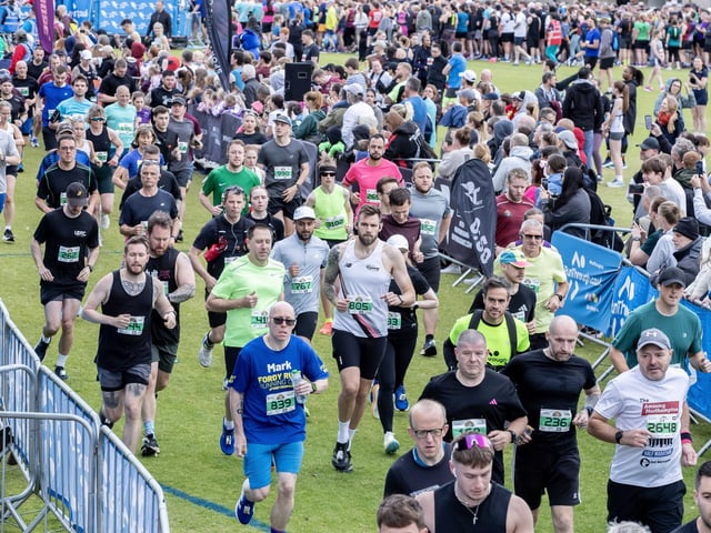 Hundreds of runners braved showers and wind to take on the race on Sunday (May 25), which started and finished at Sixfields stadium.