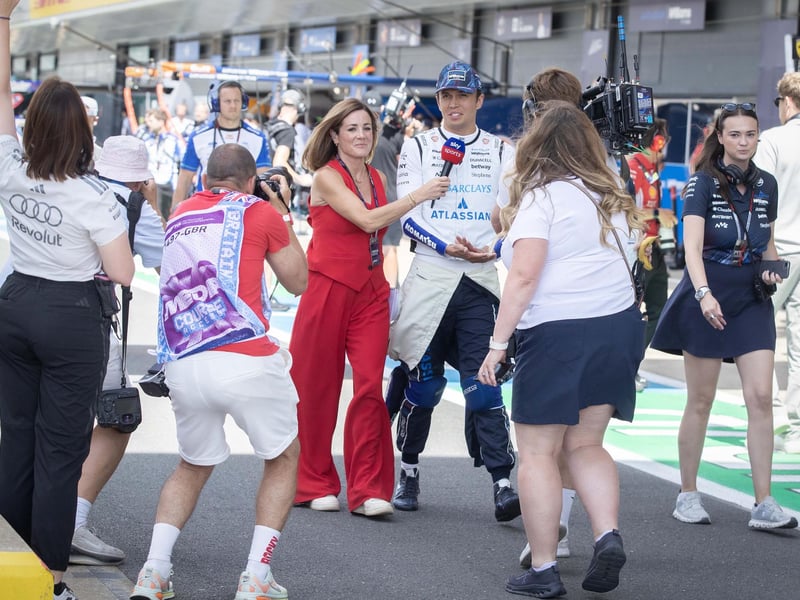 Natalie Pinkham, the F1 pit lane reporter, with Alex Albon, the Williams Racing driver.