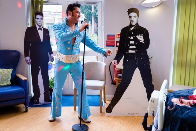 Elvis Impersonator Paul Robinson sings to a patient at Cynthia Spencer Hospice