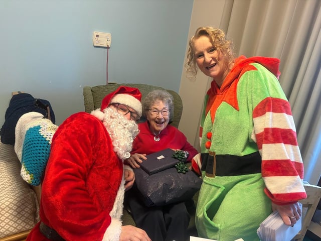 VIP Guests Santa and his helper elf deliver gifts around the home