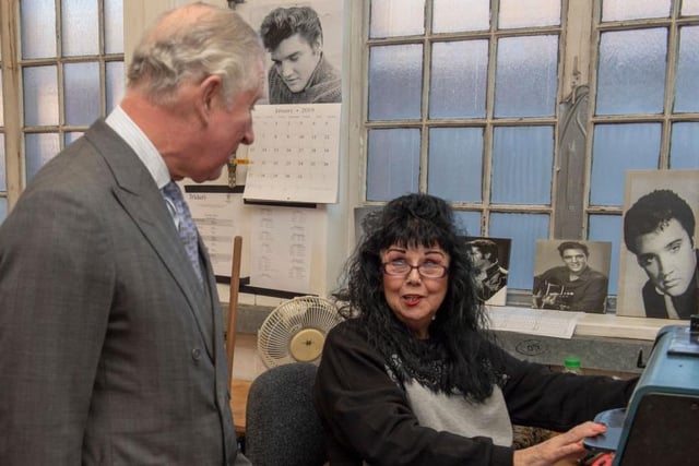 The Prince speaks to Heather Haddon as he visits shoemakers Tricker’s factory in 2019