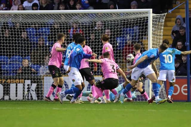 Ryan Johnson heads in Stockport's second goal.