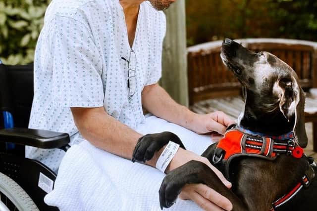Chris in rehab with his dog Elsa visiting the Central England Rehabilitation Unit.