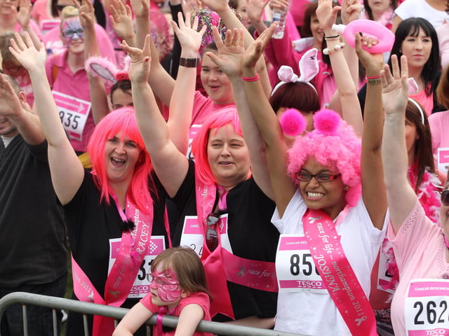 2011 - Over four thousand women warm up before the start in the 5k Race for Life at Abington Park in Northampton.