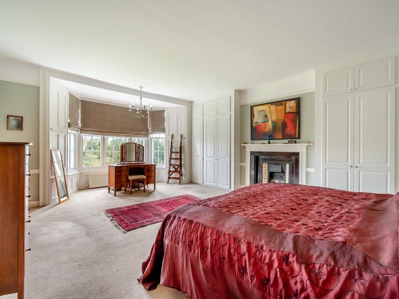 This is the first of seven bedrooms. It has two built-in wardrobes and an en suite
