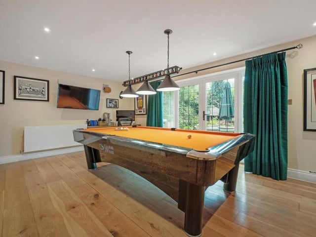 Take a look at the house's very unique games room with its own pool table and bar!