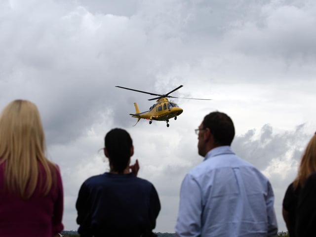 The helicopter arrived at the school grounds