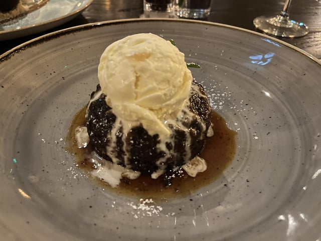Sticky toffee pudding with stem ginger ice cream.
