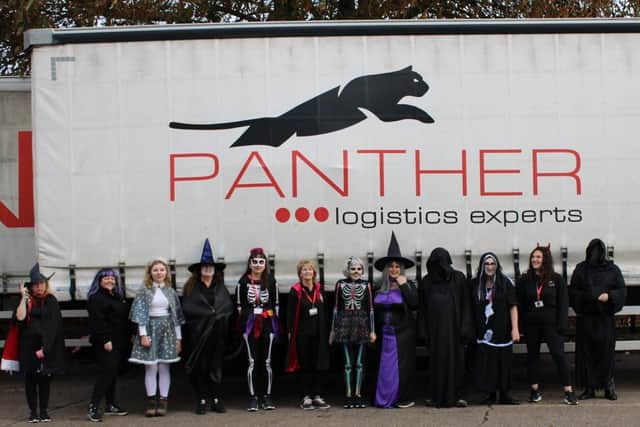 Panther Logistics team members dressed in spooky style for the successful Halloween fundraiser. 