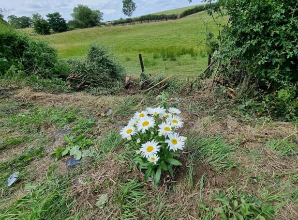 Flowers left by Denise and David Bailey in tribute to the couple killed in a car crash near Brampton Ash