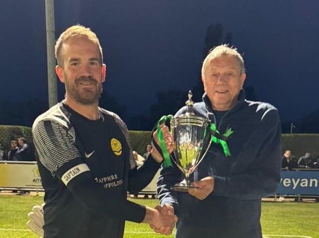 Blisworth Captain Josh Macadoo receiving the trophy.