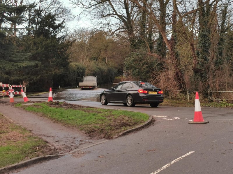 Cars turning around outside The Cromwell in Kislingbury