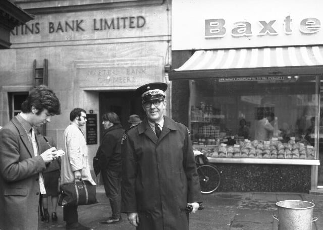 Chron reporter interviews traffic warden outside Martins Bank, possibly in Drapery or Market Square, Northampton.