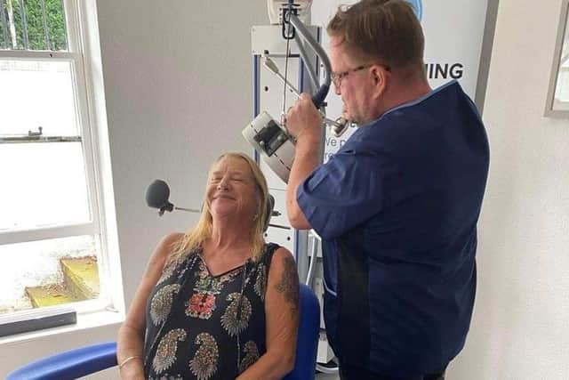 Transforming Mind Solutions lead practitioner Richard Williams administering TMS treatment. 