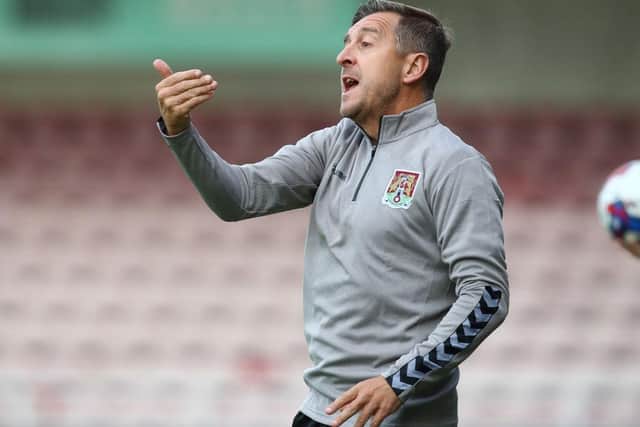 Jon Brady on the touchline at Sixfields.