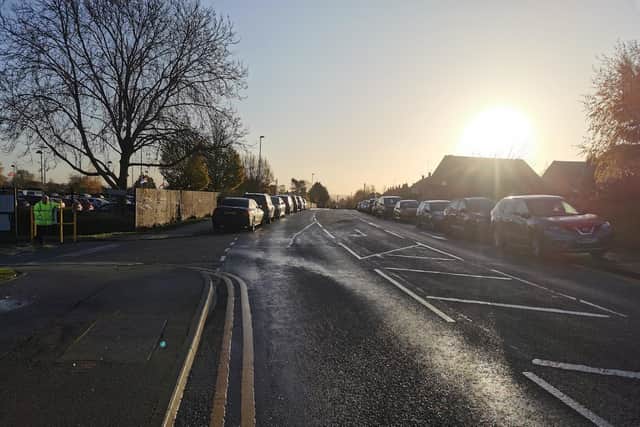 Parking outside Duston School (left) on Friday (November 25) just before 9am