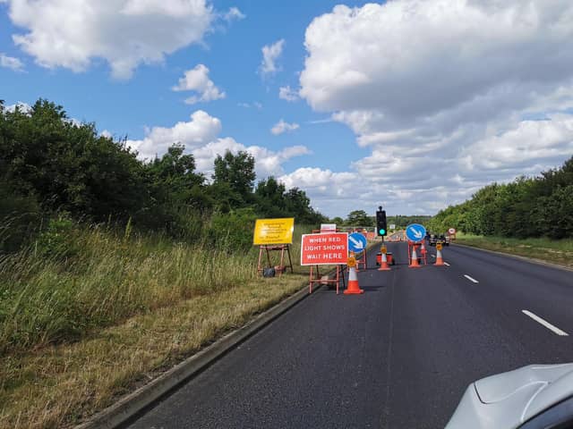 According to roadworks.org, the temporary traffic lights on New Sandy Lane will be in place until October