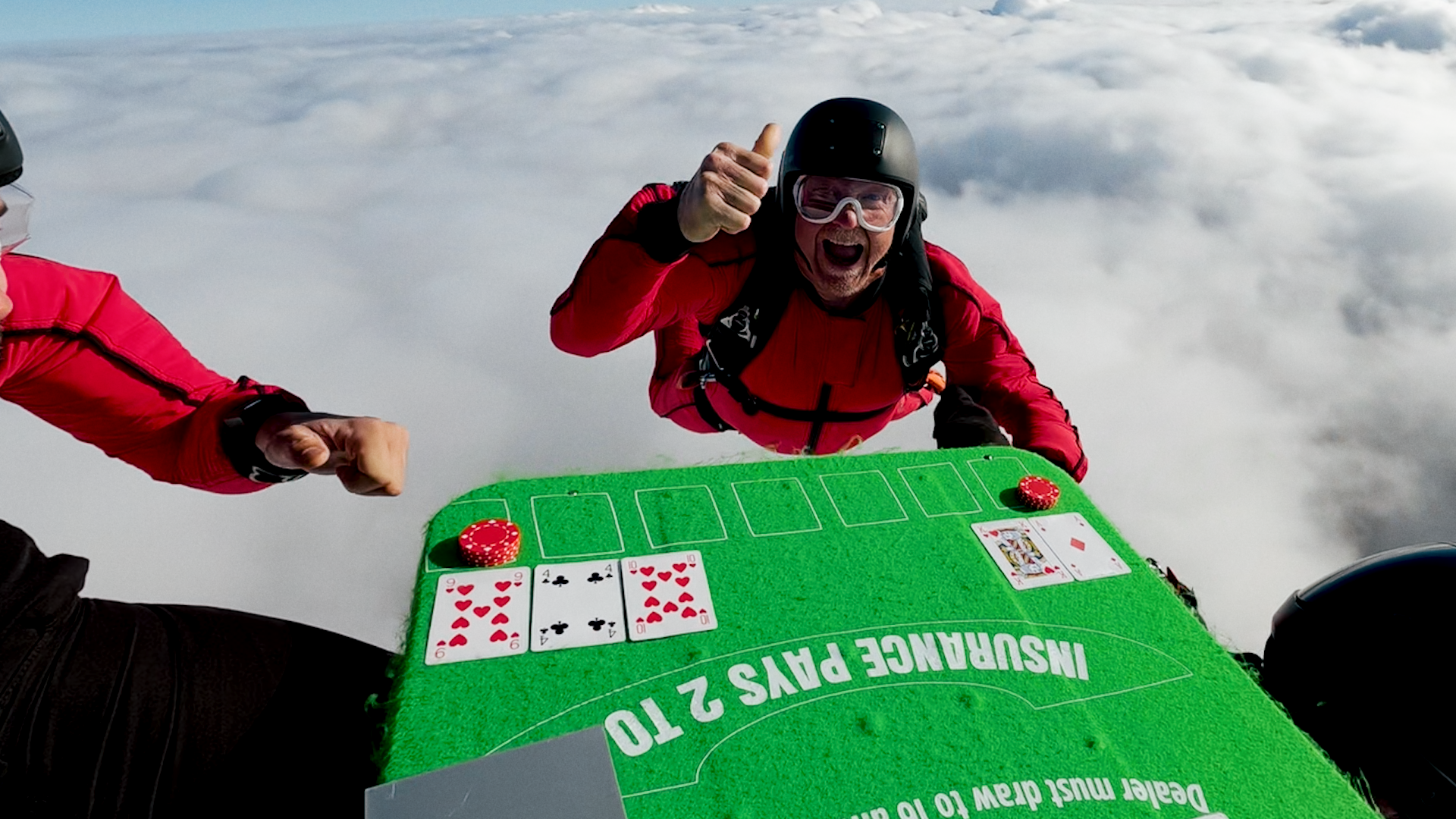 Skydivers play blackjack at 120mph during 13,000ft freefall over ...