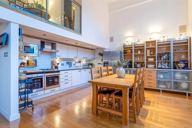 The large open-plan kitchen has two ovens and a gas hob.