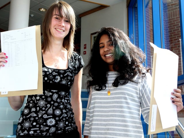 GCSE 2010 exam results day at Northampton High School (All girls school), Wootton Fields, Newport Pagnell Road, South Northants. Natasha Pumchihewa and Eleanor Barnes (right to left)