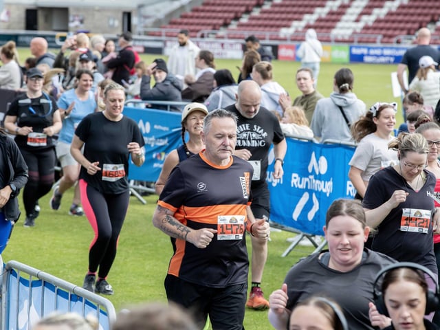 Hundreds of runners braved showers and wind to take on the race on Sunday (May 25), which started and finished at Sixfields stadium.