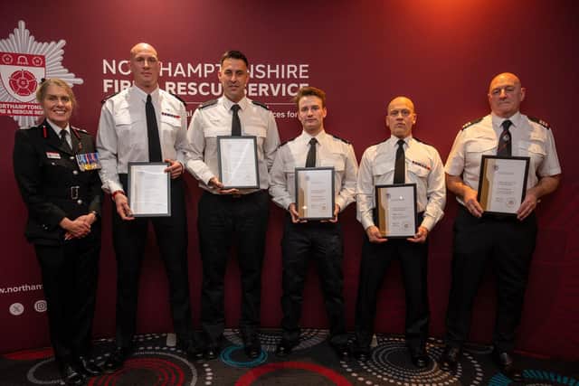 Chief Fire Officer Nikki Watson presents the water rescue crew from Mereway with their commendation for assisting a man on the banks of the River Nene