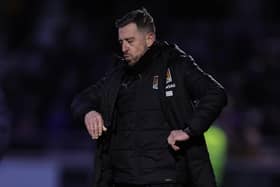 Cobblers boss Jon Brady shows his frustration during Saturday's 2-0 defeat at the hands of Shrewsbury Town (Photo by Pete Norton/Getty Images)