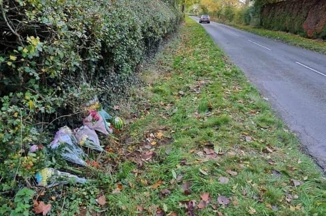 Flowers left at the scene the day after the crash