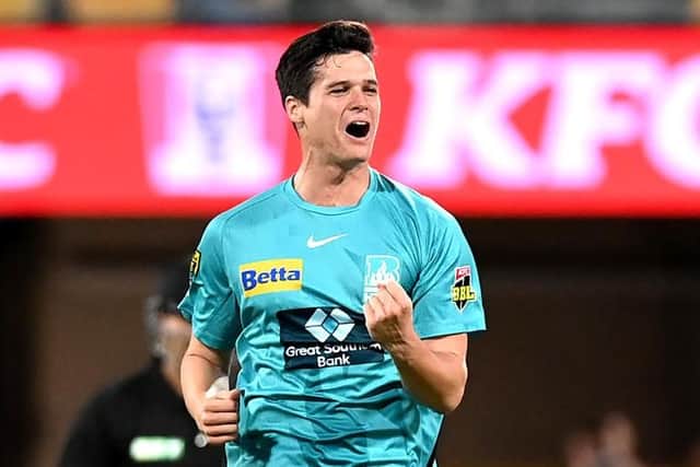 Liam Guthrie celebrates claiming a wicket for Brisbane Heat in the Big Bash League