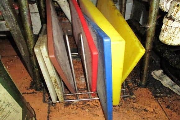 Hygiene inspectors found rotten and filthy chopping boards being kept on a kitchen floor during an inspection at the Honey Moon Chinese takeaway in September 2021