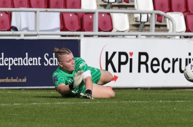 Cobblers goalkeeper Katie McLean makes a save low down