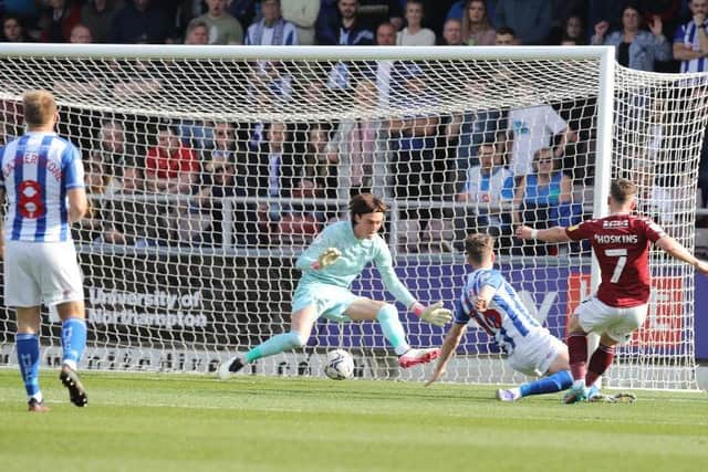 Sam Hoskins slots through the keeper's legs to give Cobblers an early lead in last season's home fixture against Hartlepool.
