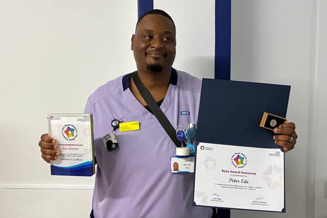 Healthcare Assistant Peter Ede with his award.