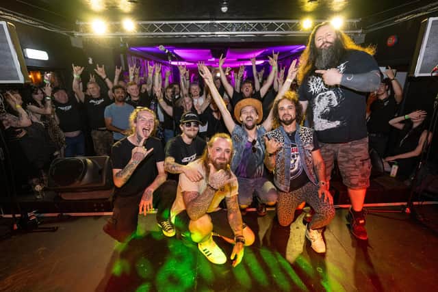 Metal 2 The Masses Northants organiser Skye Day pictured with winners Backseat Juliet and judge Neil Hudson at The Black Prince in Northampton on Saturday, June 28, 2025. Photo by David Jackson.