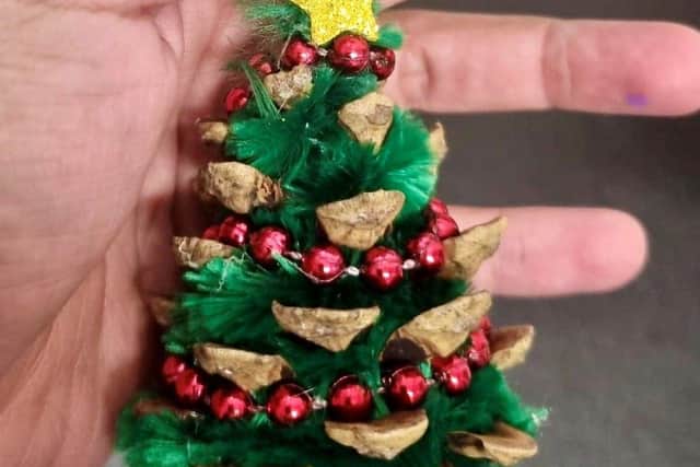 One of their beautifully decorated pine-cones