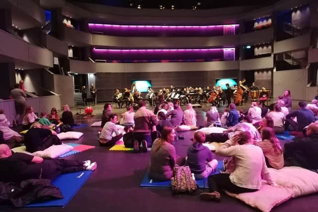 The audience enjoy relaxed seating listening to the concert.