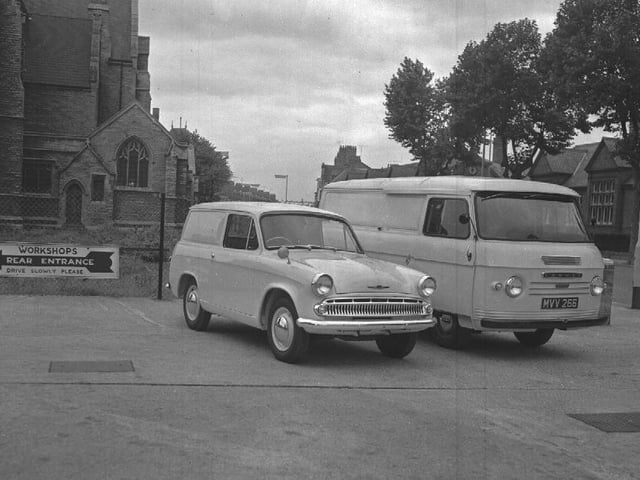 Hilman Husky van and Commer van in Wellingborough Road, Northampton with Christ Church in background and Burlington shoe factory across the road