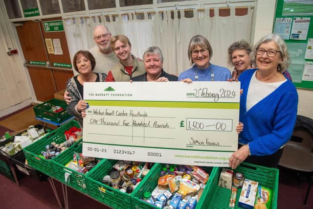 BN - SGB-31736 - The team at Weston Favell Foodbank with the cheque from Barratt Homes