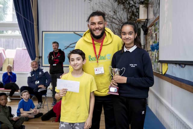 Lewis, who is pictured here handing over the Anderson cup, recently became an ambassador for the Northampton Saints Foundation. While talking to the students, he said his role models in rugby as he was growing up were those who looked like him, including Steffon Armitage – though, he admitted there were not many.