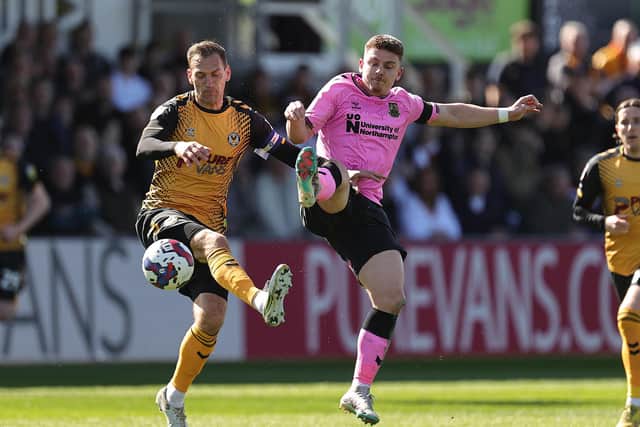 Sam Hoskins charges down a clearance. Pictures: Pete Norton.