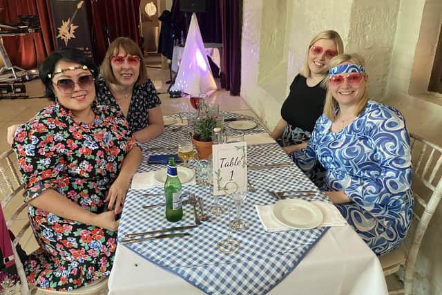 Some attendees came dressed in Mamma Mia inspired outfits, like this table of four.
