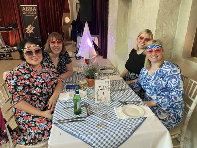 Some attendees came dressed in Mamma Mia inspired outfits, like this table of four.