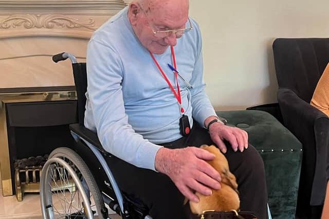 Brampton View Care Home resident and former keen racegoer Len with Pablo The Pup