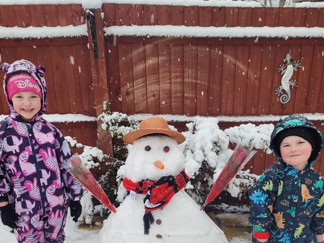 Freya and Louie loved Building a snowman this morning.